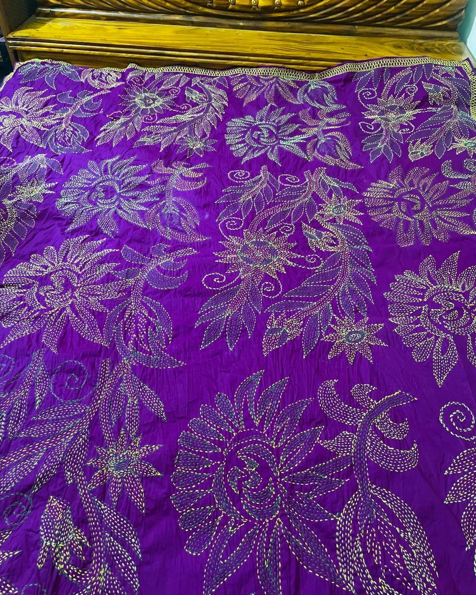 Purple nakshi kantha bedspread with sunflowers stitched in gold and green thread