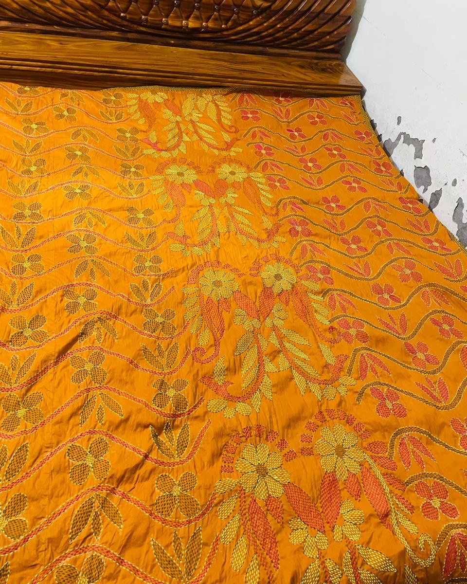 Saffron kantha bedspread with gold and coral running stitch
